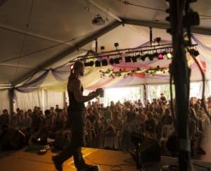 Jost Sauer speaking at Woodford Folk FEstival